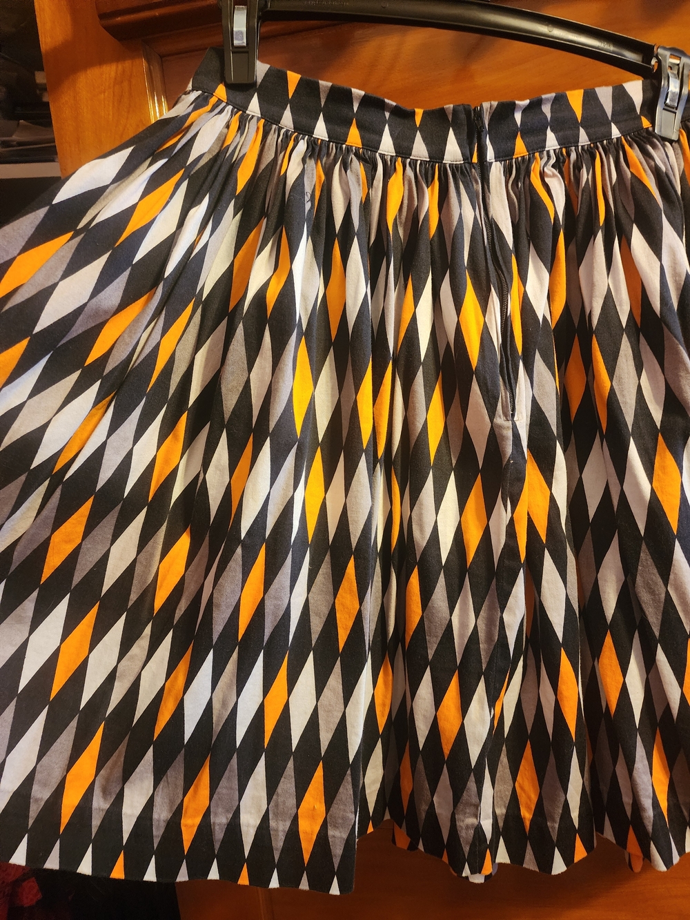 Harlequinn Black, White & Orange Printed Pleated Women’s Skirt